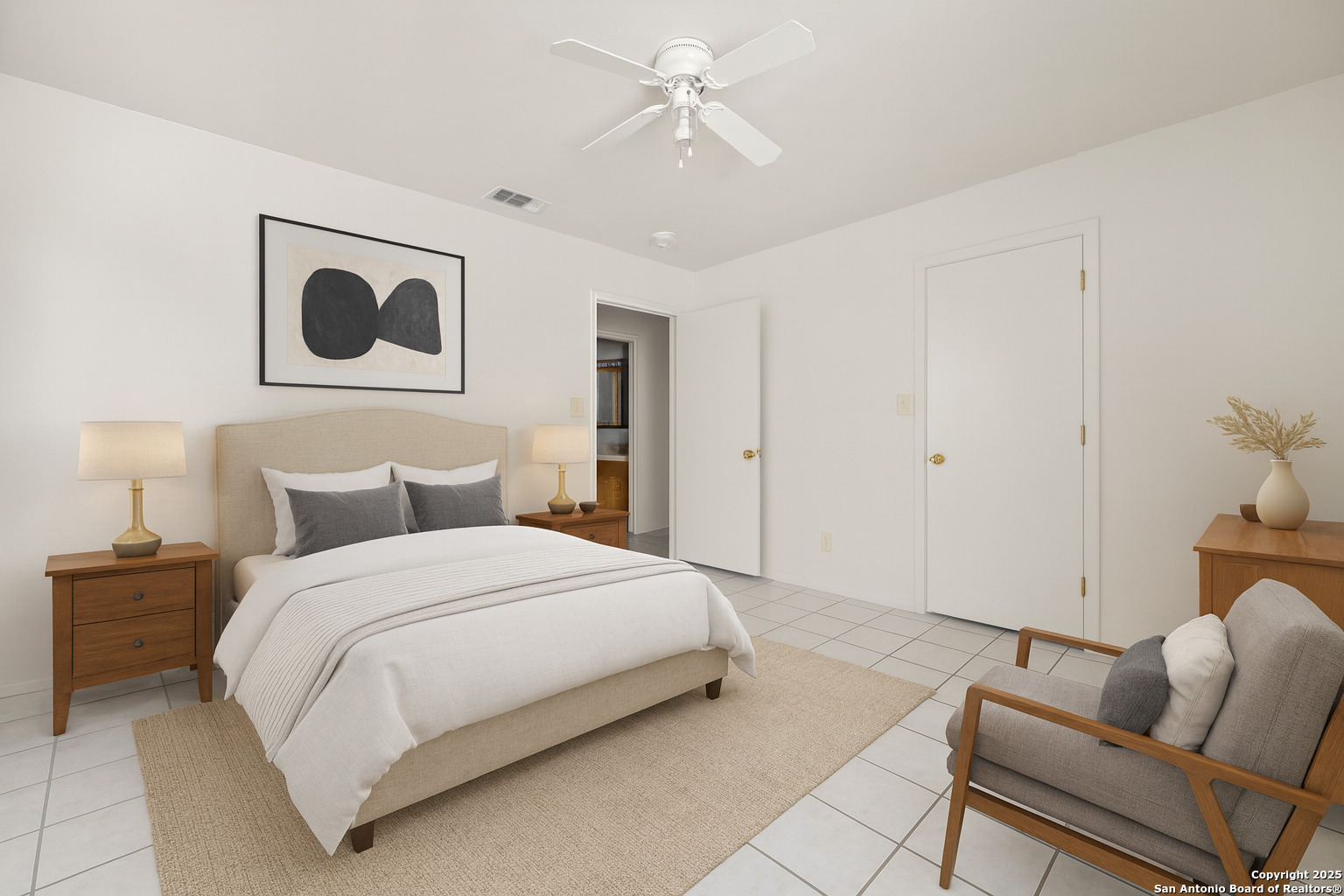 1118 West Goodwin Street, Unit C Pleasanton, TX 78064 - Photo 6 of 13 a bedroom with a bed and ceiling fan