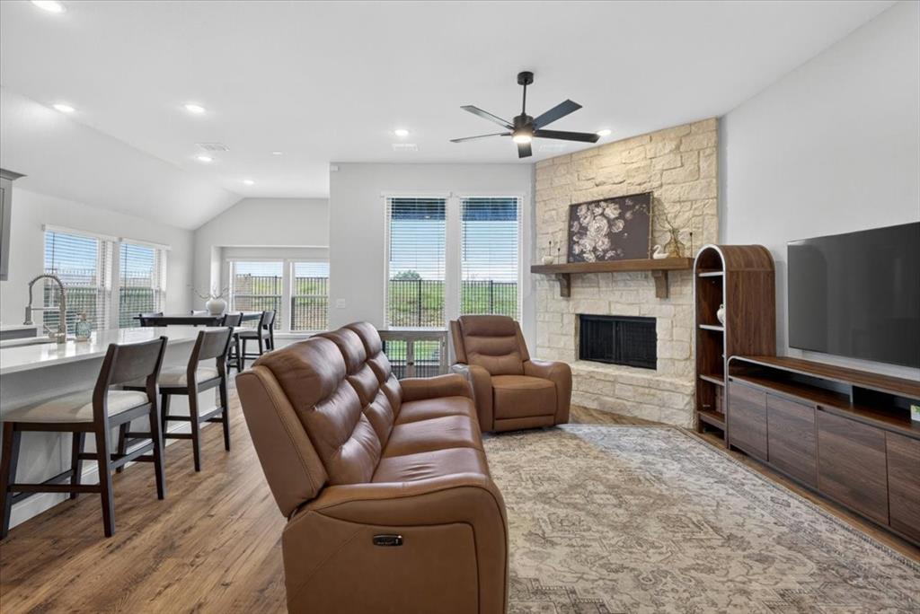 653 Godley Ranch Godley, TX 76044 - Photo 5 of 35 a living room with fireplace furniture and a flat screen tv