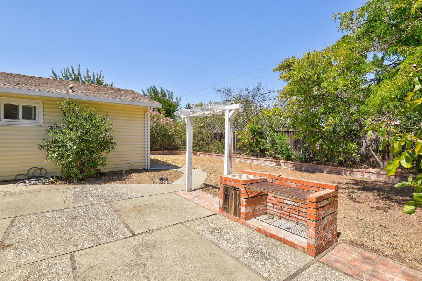 20631 McClellan Road Cupertino, CA 95014 - Photo 13 of 26 a view of a house with backyard and sitting area