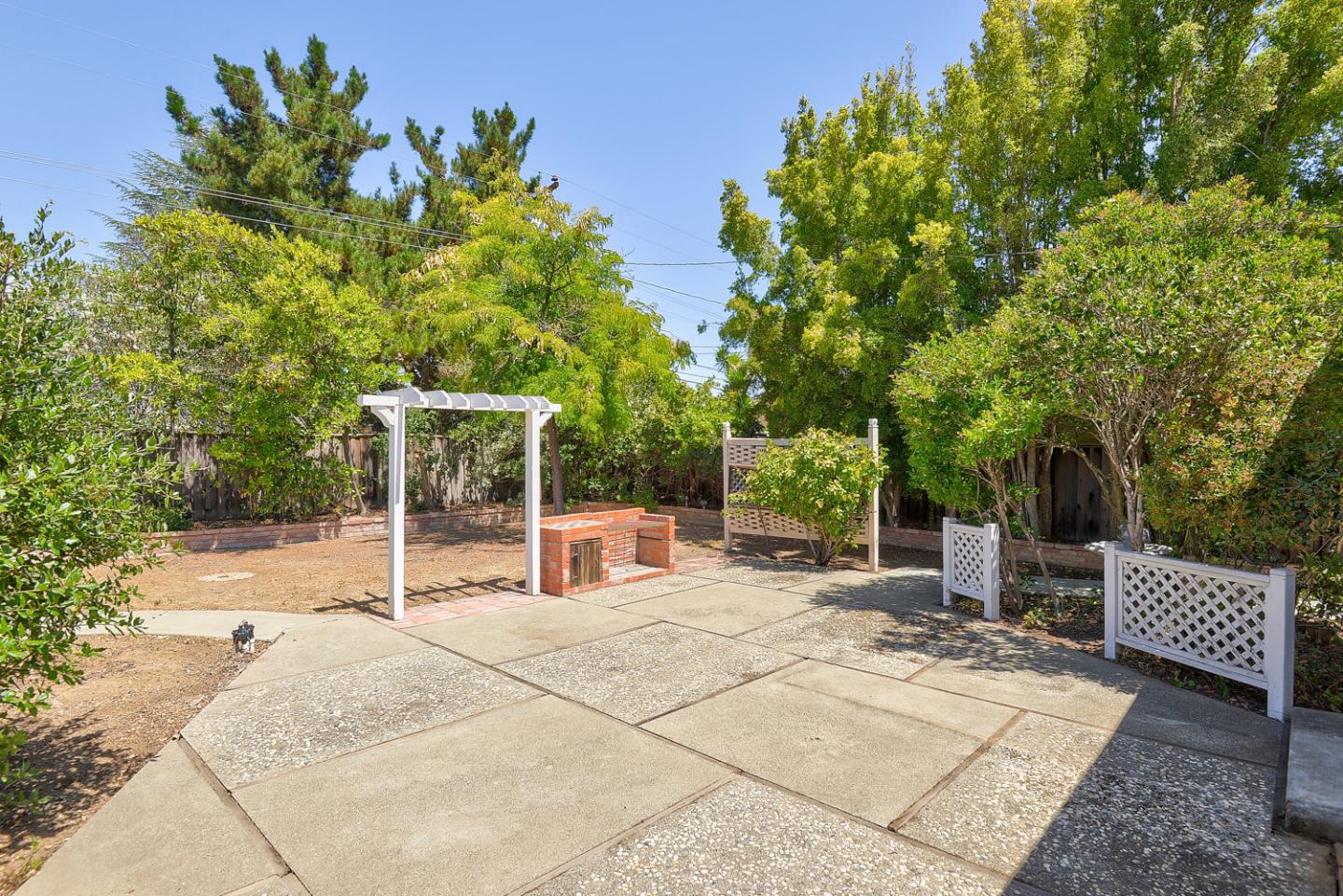 20631 McClellan Road Cupertino, CA 95014 - Photo 15 of 26 a view of a backyard with sitting area