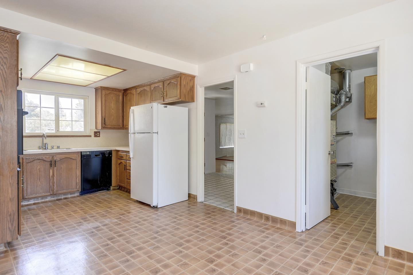 20631 McClellan Road Cupertino, CA 95014 - Photo 17 of 26 a kitchen with a refrigerator and a sink
