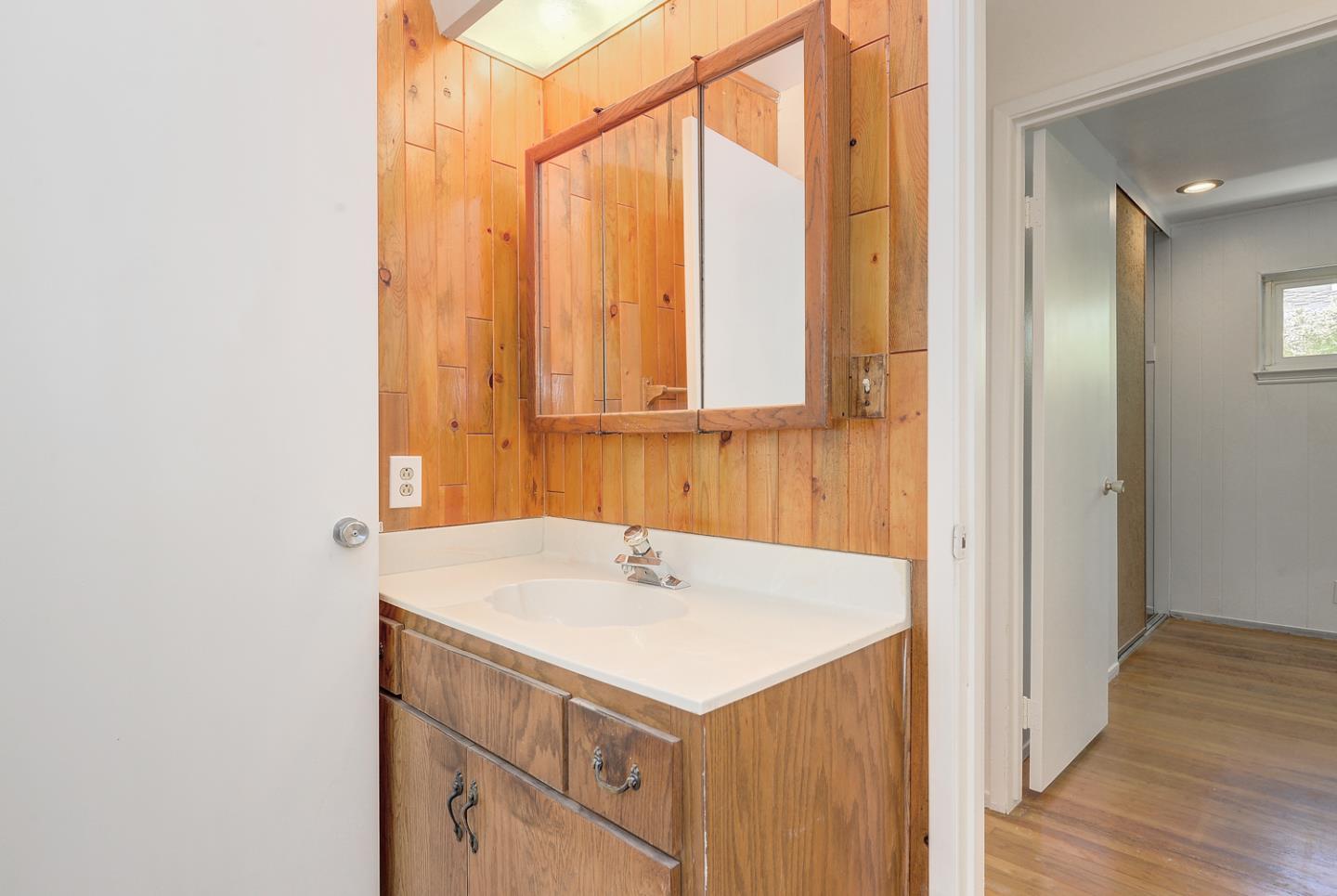 20631 McClellan Road Cupertino, CA 95014 - Photo 21 of 26 a bathroom with a sink and a mirror