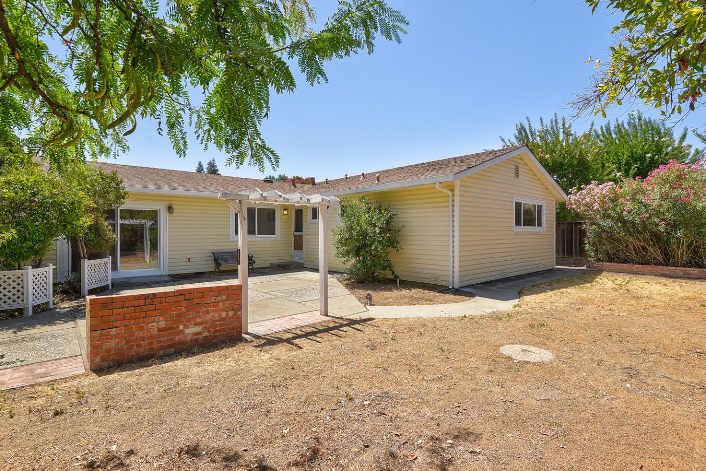 20631 McClellan Road Cupertino, CA 95014 - Photo 24 of 26 a backyard of a house with seating space