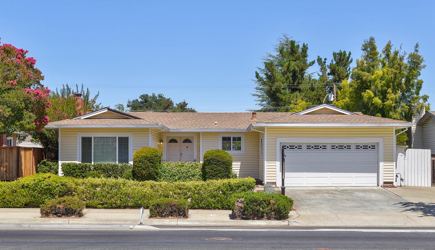 20631 McClellan Road Cupertino, CA 95014 - Photo 26 of 26 a front view of a house with a yard and garage