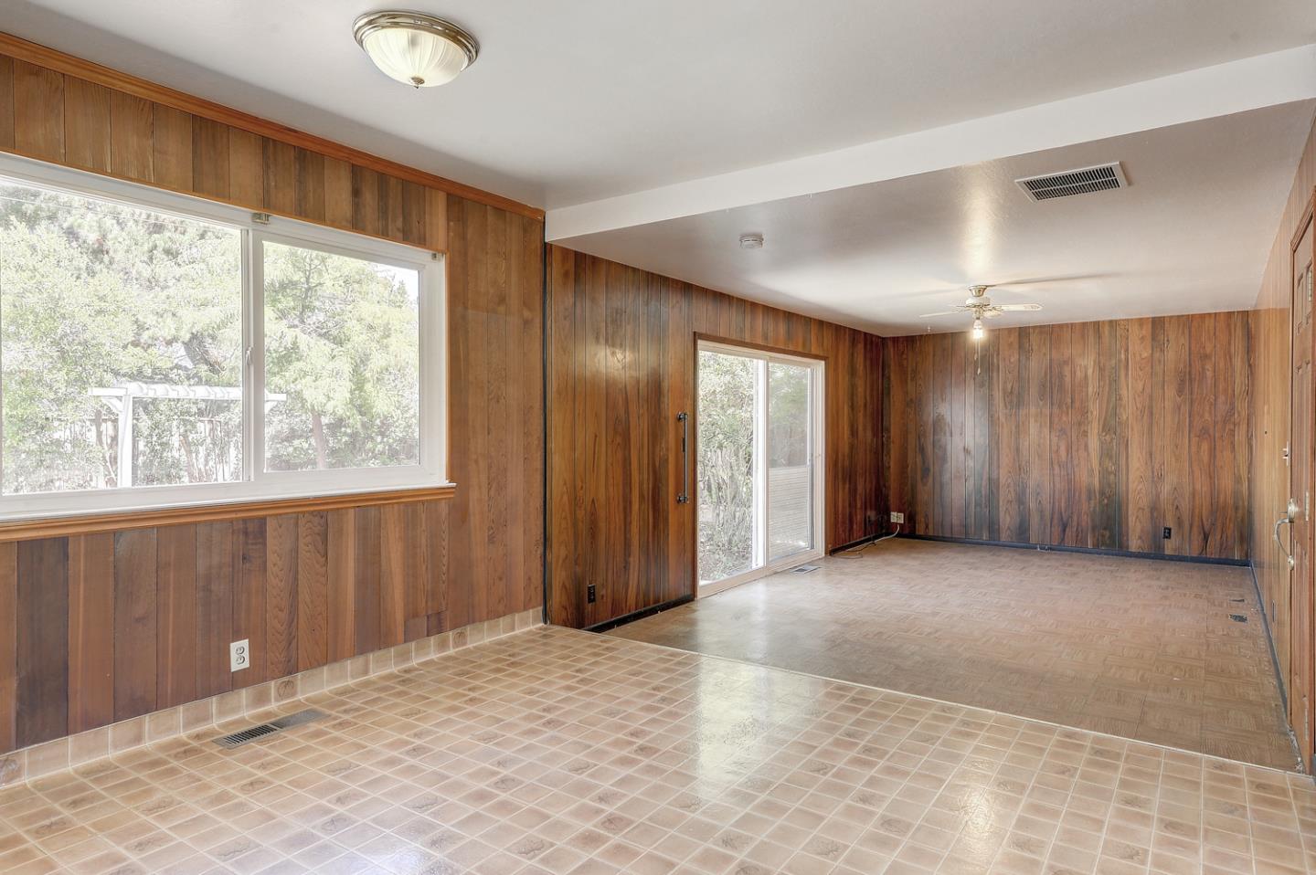 20631 McClellan Road Cupertino, CA 95014 - Photo 3 of 26 a view of an empty room with a window