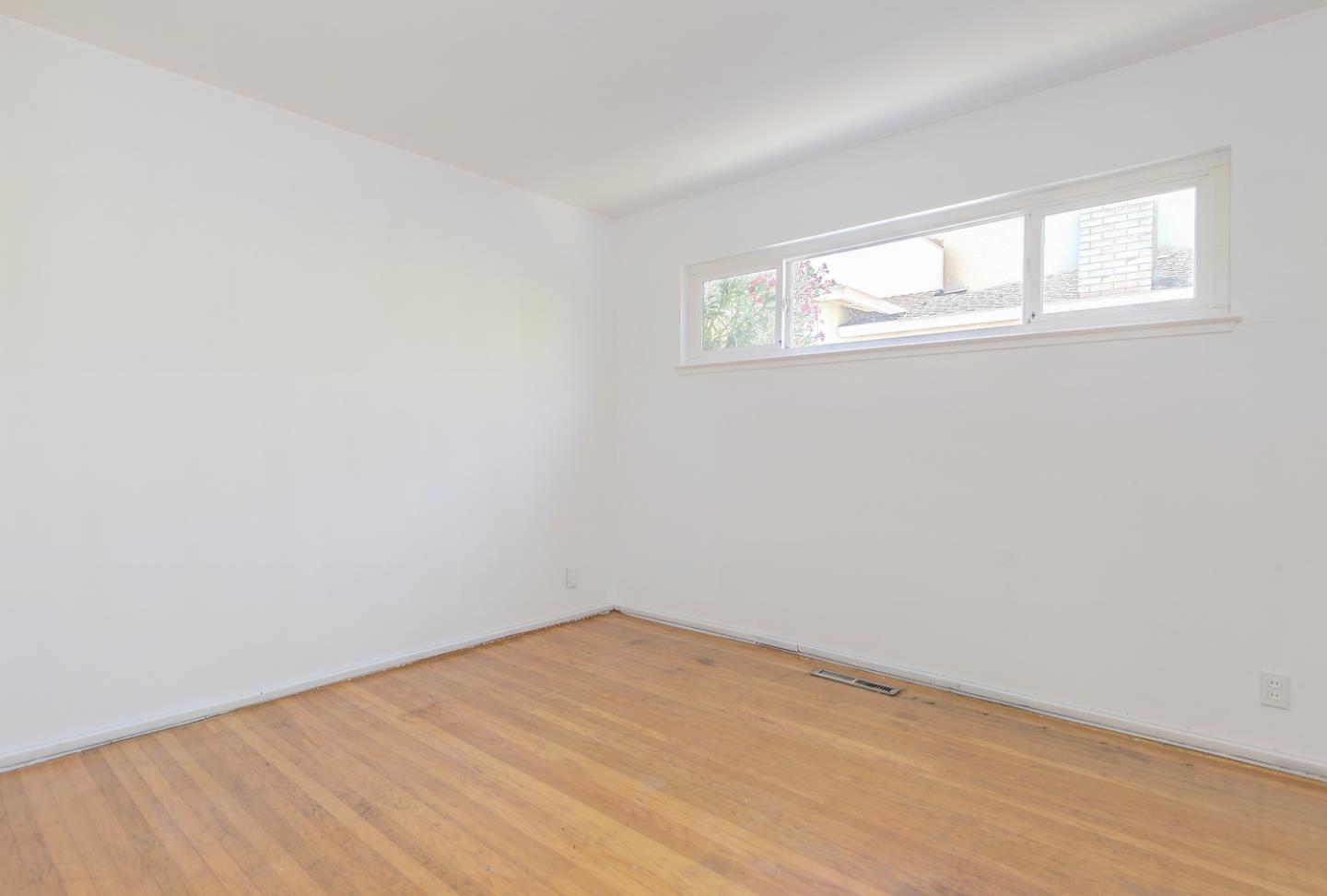 20631 McClellan Road Cupertino, CA 95014 - Photo 8 of 26 an empty room with a window
