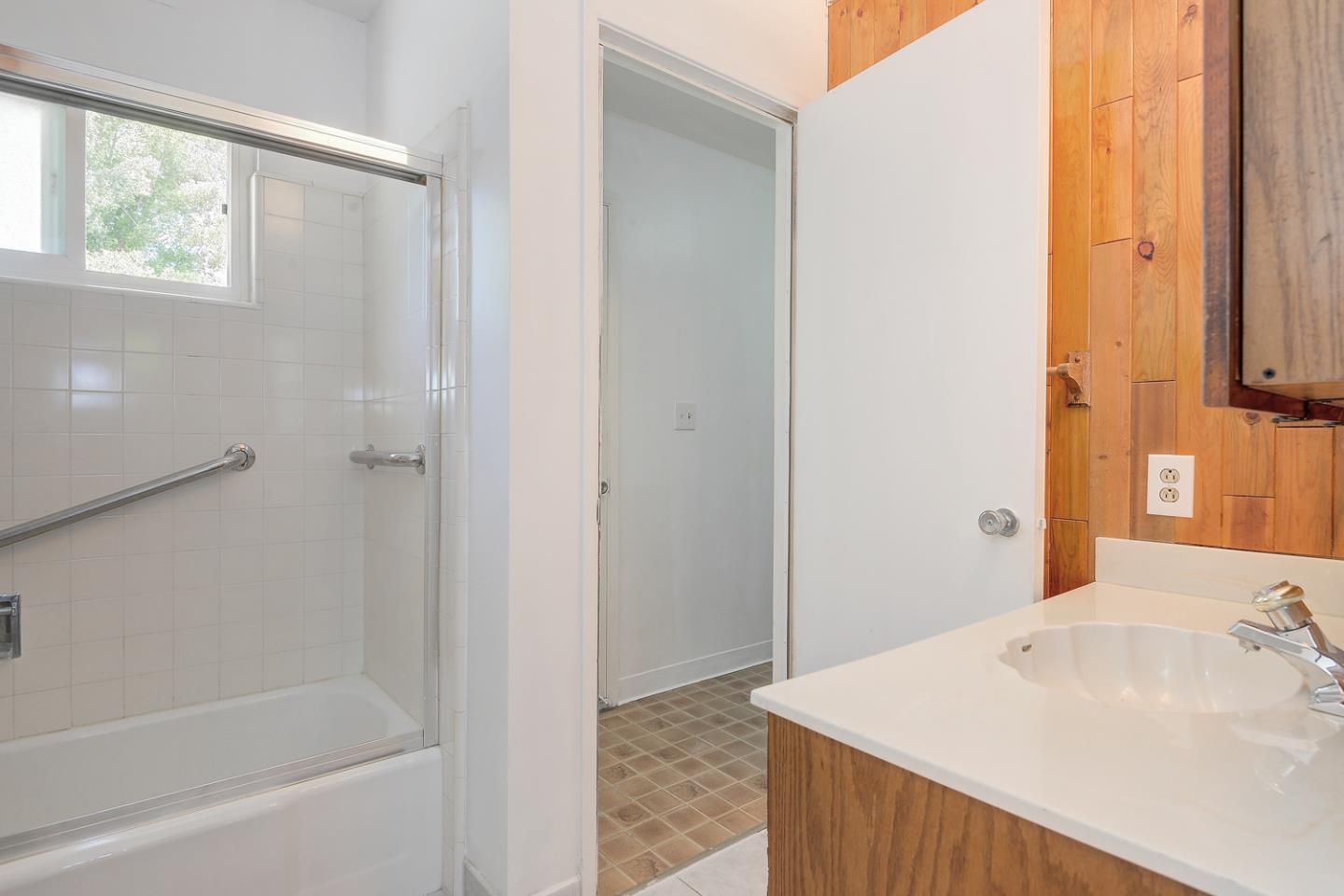 20631 McClellan Road Cupertino, CA 95014 - Photo 10 of 26 a bathroom with a bathtub and a sink