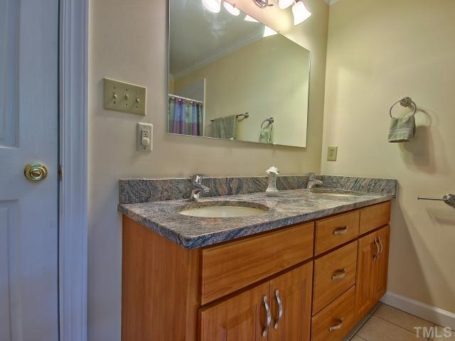 113 Bayleaf Drive Raleigh, NC 27615 - Photo 12 of 23 Master bath has his and her vanities with granite countertop