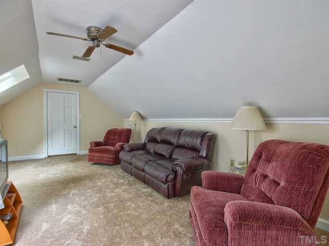 113 Bayleaf Drive Raleigh, NC 27615 - Photo 18 of 23 Another view shows the knee-wall storage closets