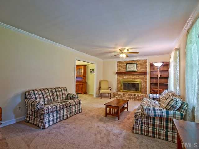 113 Bayleaf Drive Raleigh, NC 27615 - Photo 4 of 23 Another view of family room showing it opening into dining room