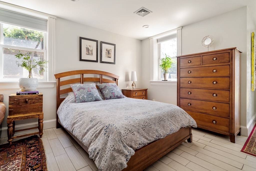70 Oxford Street Somerville, MA 02143 - Photo 29 of 38 a bedroom with a bed and a dresser