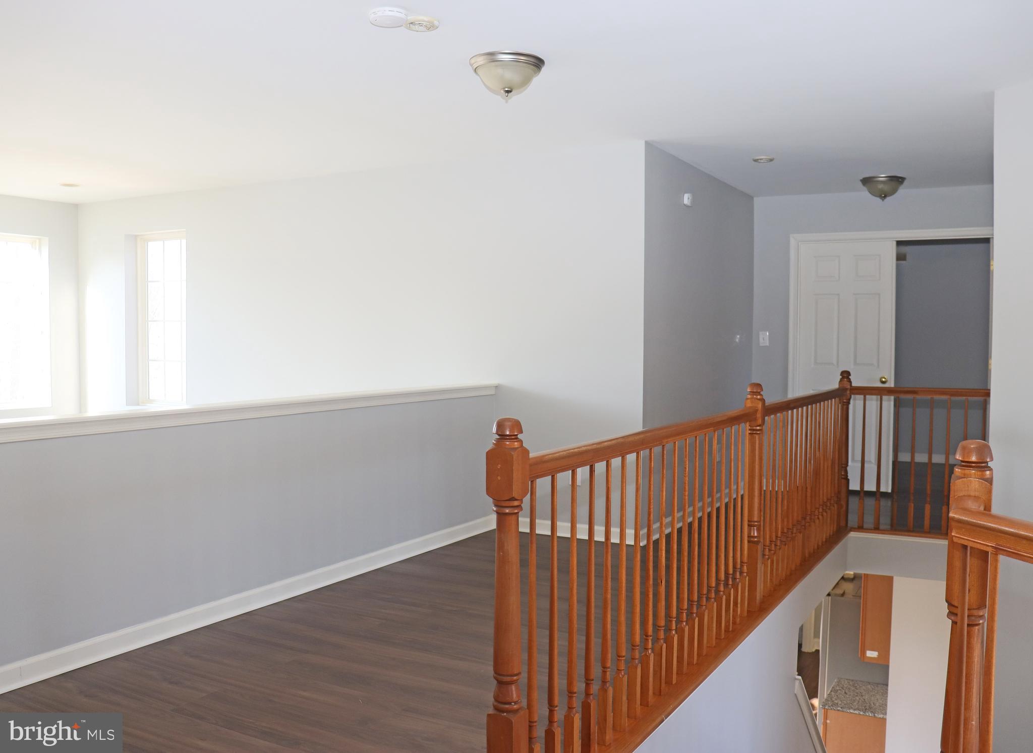24 Blue Spruce Drive Bear, DE 19701 - Photo 12 of 13 a view of hallway with wooden floor