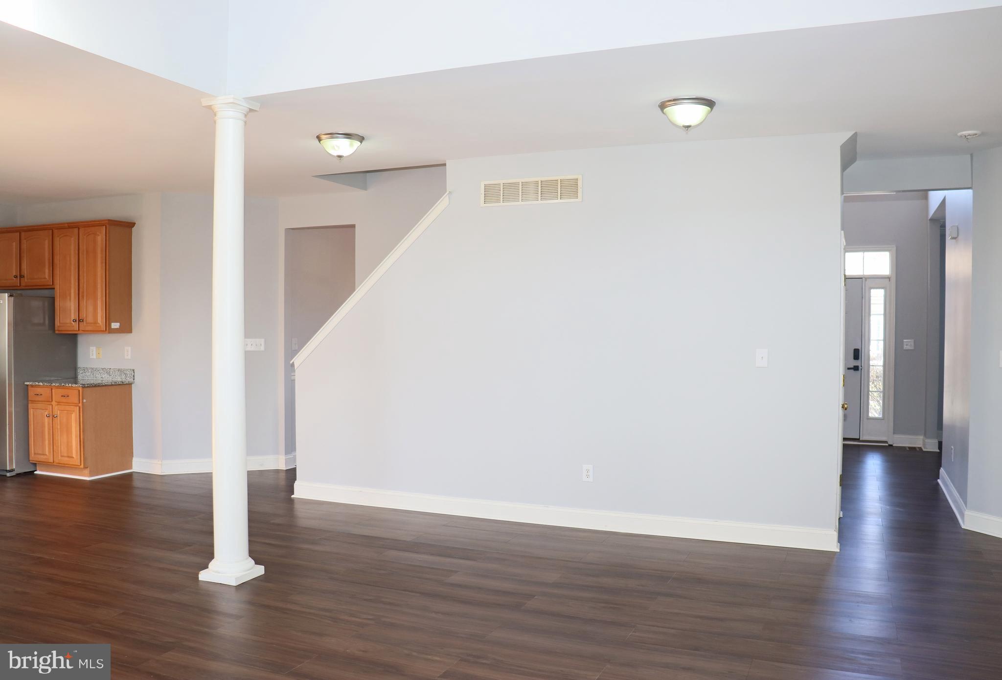 24 Blue Spruce Drive Bear, DE 19701 - Photo 7 of 13 a view of a hallway with wooden floor