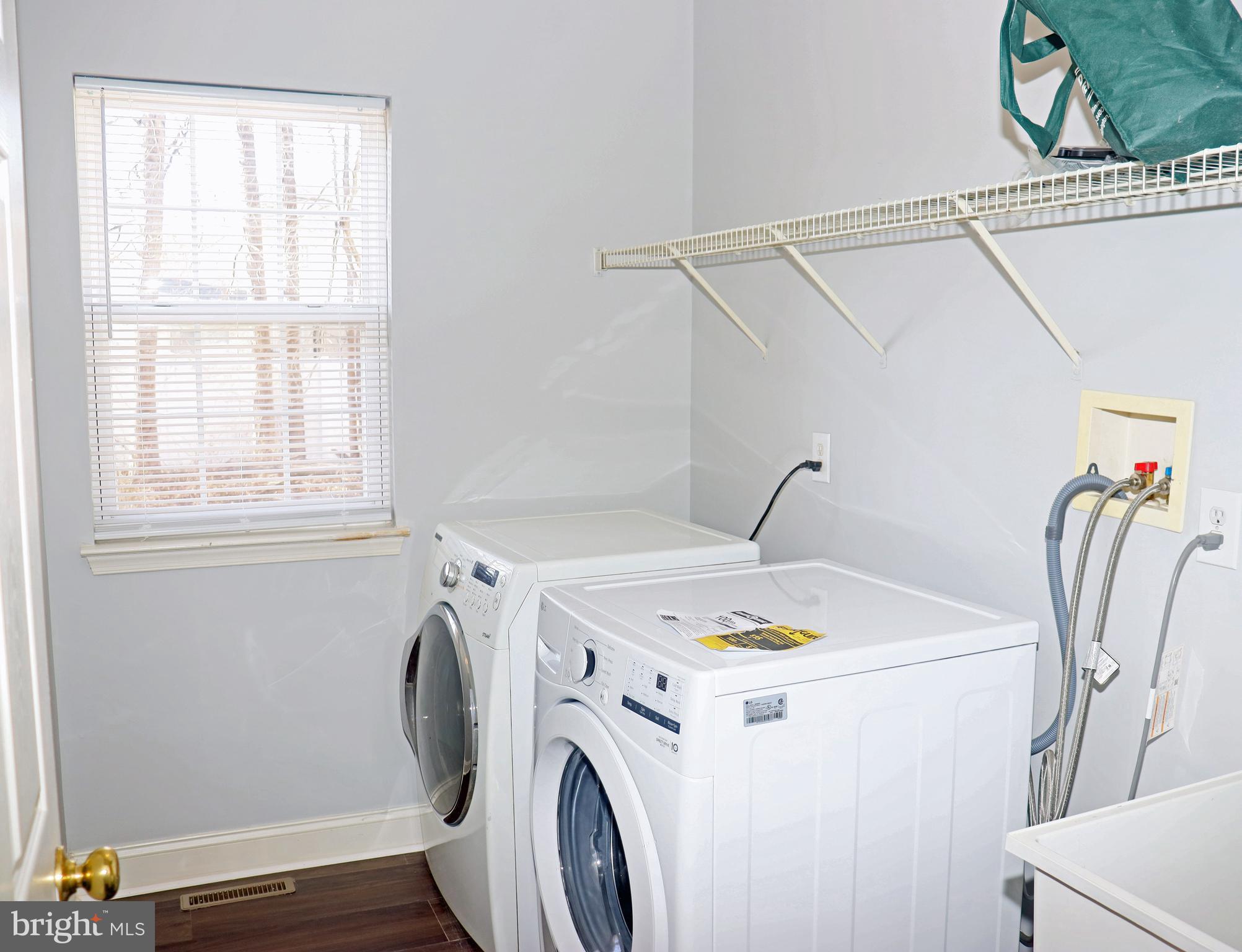 24 Blue Spruce Drive Bear, DE 19701 - Photo 9 of 13 a utility room with dryer and washer