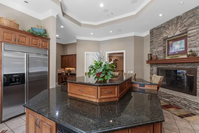 a view of a dining room with furniture a chandelier and wooden floor