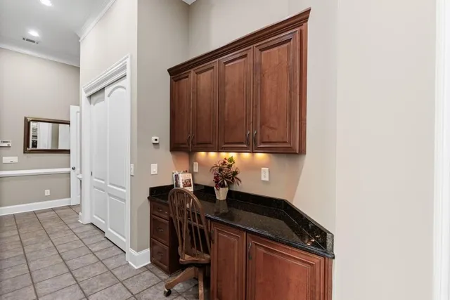 a spacious bathroom with a granite countertop sink mirror and a
