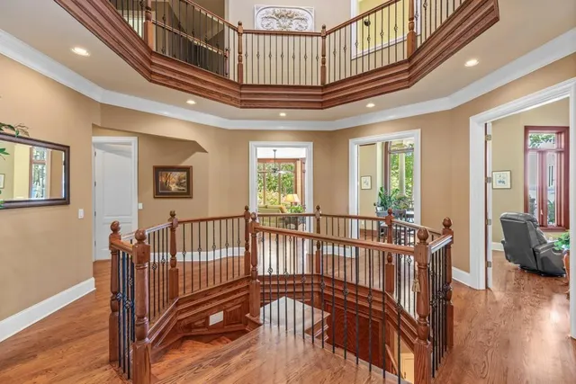 a view of a chairs and table in the balcony