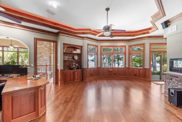 a living room with furniture and a floor to ceiling window