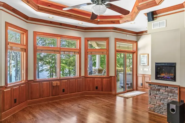 a bathroom with a granite countertop sink a large mirror and a shower