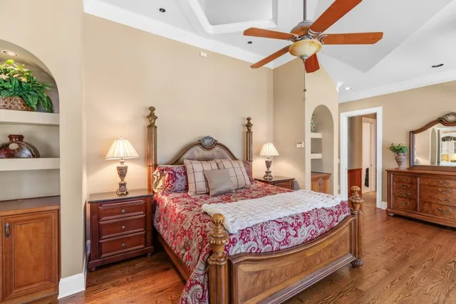 a view of a house with backyard sitting area and swimming pool