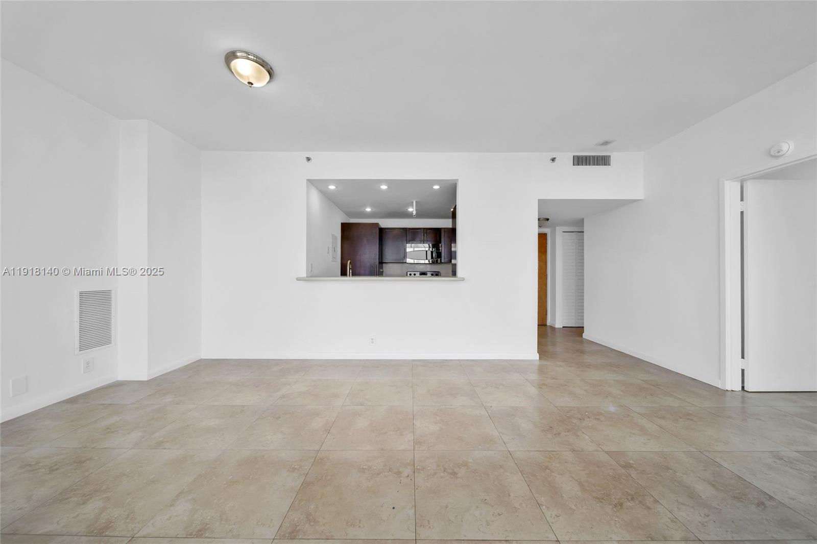 7601 East Treasure Drive, Unit PH215 North Bay Village, FL 33141 - Photo 12 of 40 a view of a livingroom with a fireplace