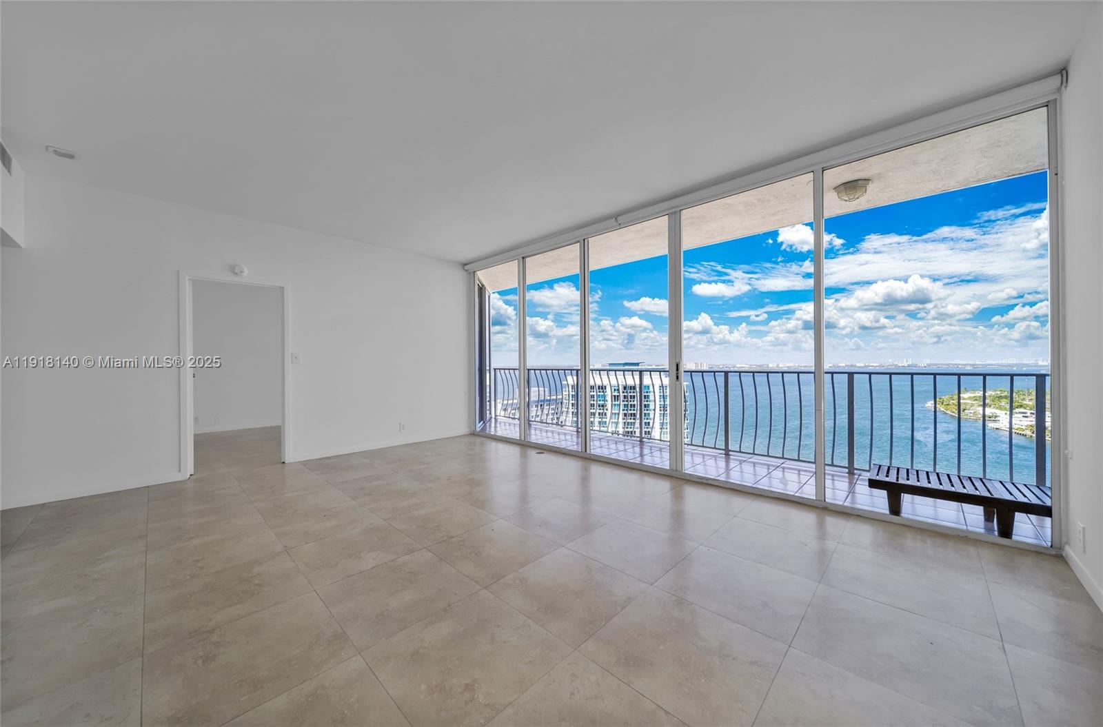7601 East Treasure Drive, Unit PH215 North Bay Village, FL 33141 - Photo 15 of 40 a view of an empty room with a balcony