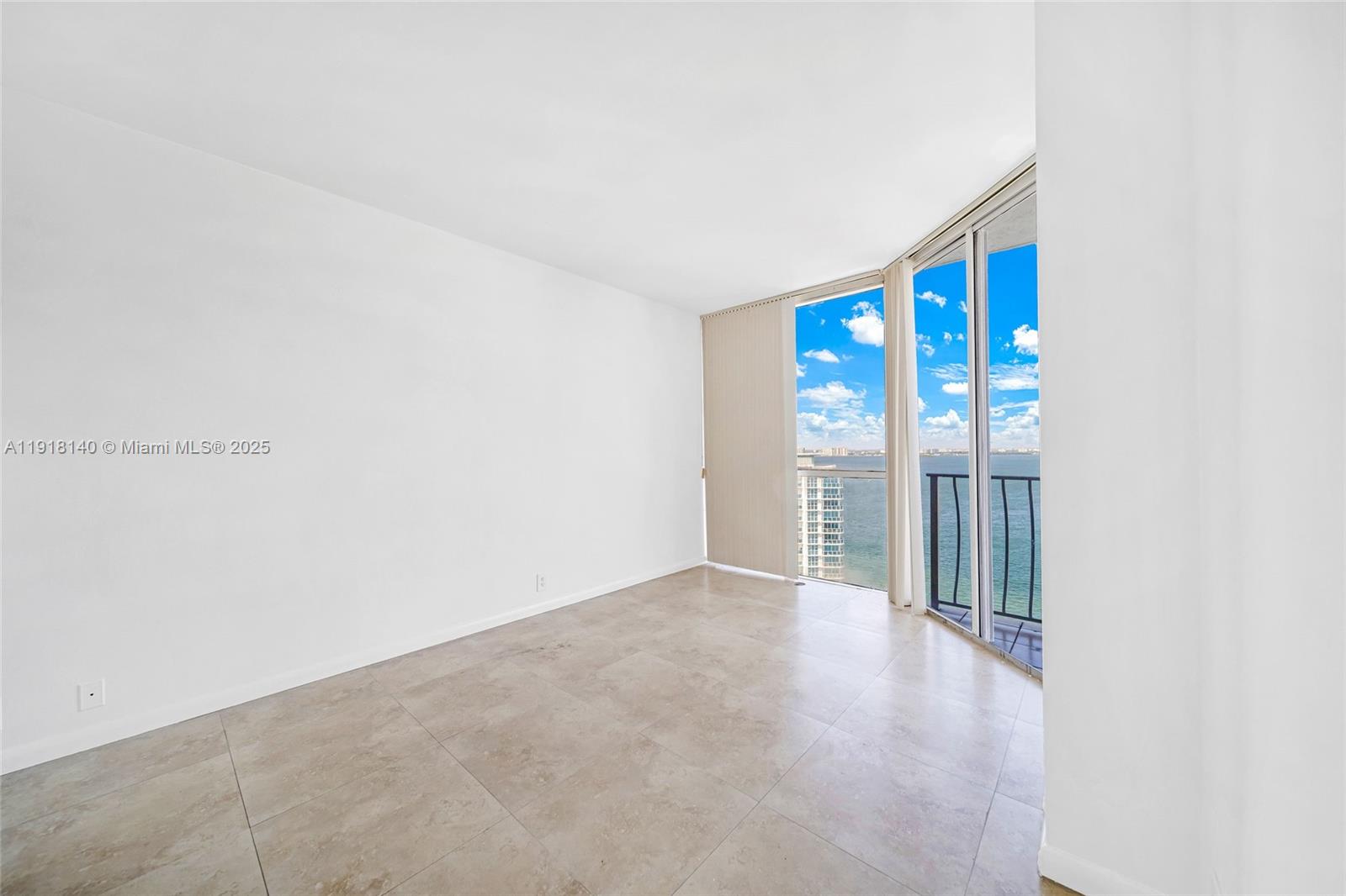 7601 East Treasure Drive, Unit PH215 North Bay Village, FL 33141 - Photo 18 of 40 a view of an empty room with glass door
