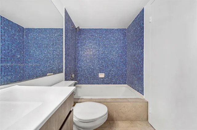 a bathroom with a toilet and a bathtub