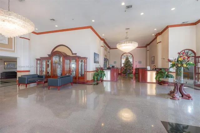 a view of a lobby with furniture and a chandelier