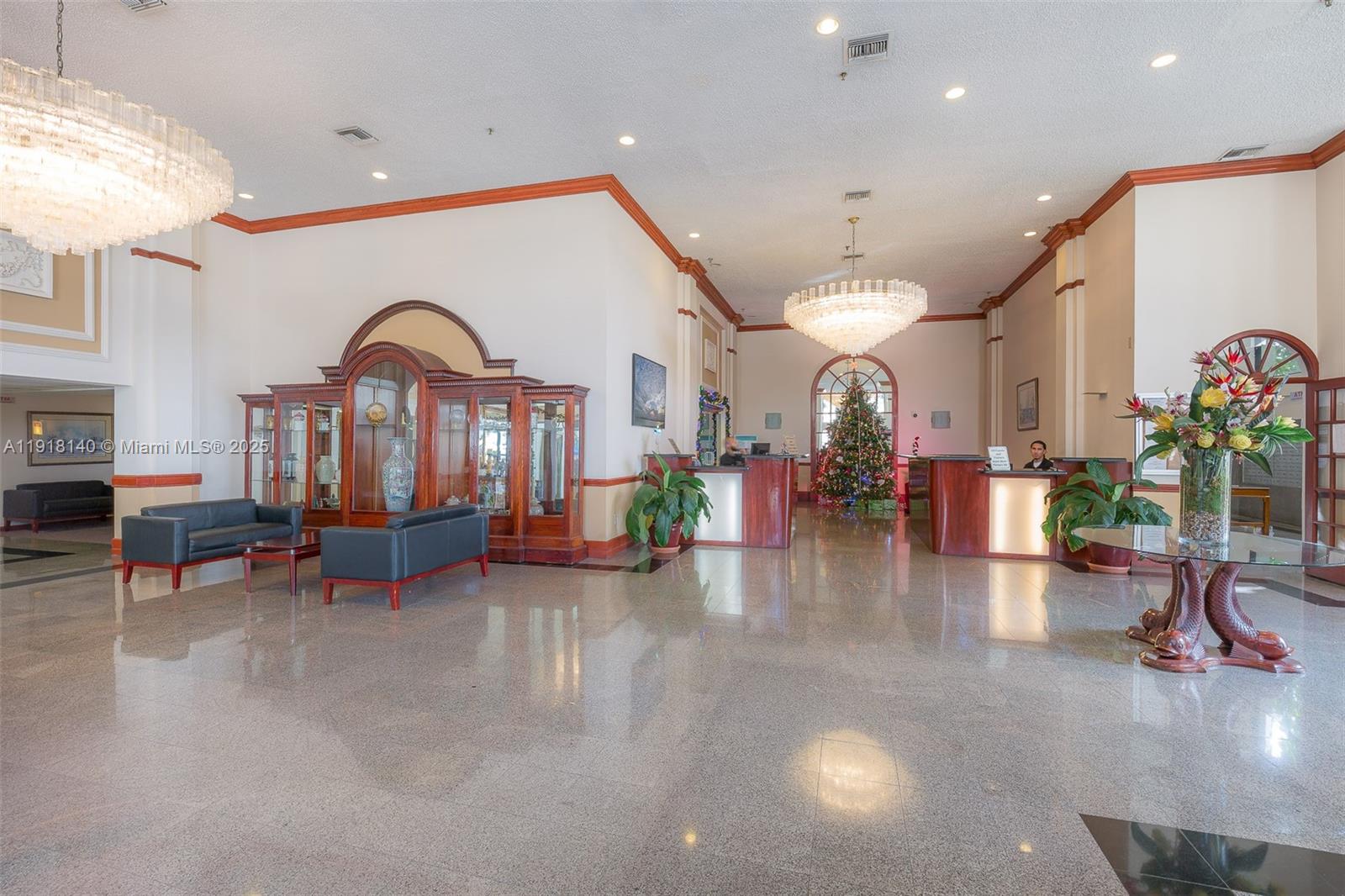 7601 East Treasure Drive, Unit PH215 North Bay Village, FL 33141 - Photo 32 of 40 a view of a lobby with furniture and a chandelier