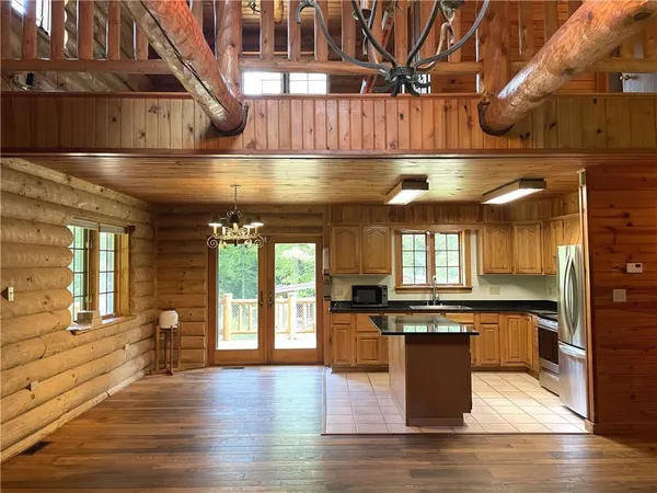 a kitchen with stainless steel appliances granite countertop a sink and a stove