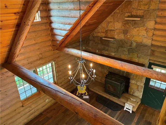 a bathroom with a window and a wooden floor