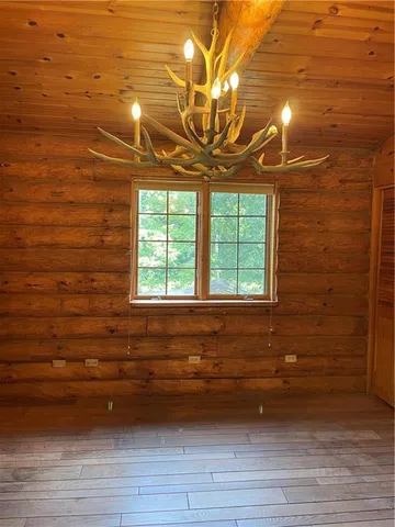 a room with wooden floor and closet