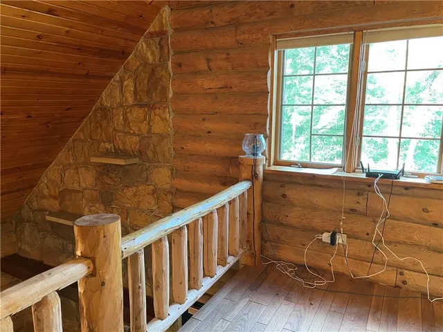 a bathroom with a toilet and a mirror