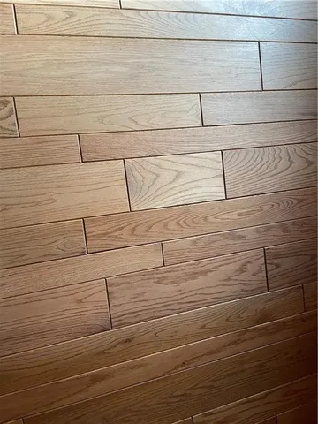 a bedroom with a bed and a black umbrella