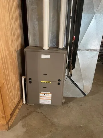 a view of a swimming pool with a big yard and a large trees