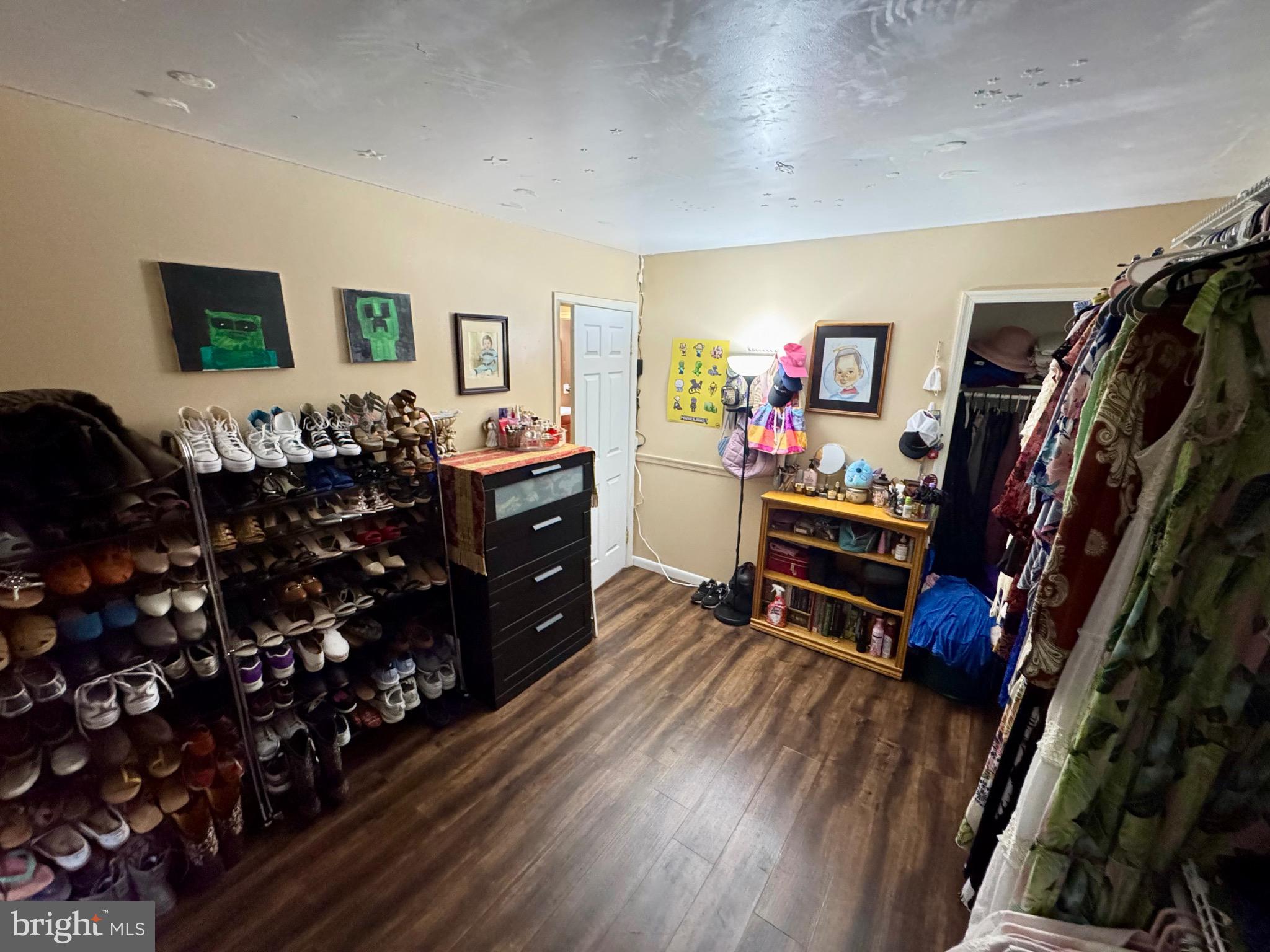 9215 Landgreen Street Manassas, VA 20110 - Photo 17 of 18 a living room with lots of furniture and a wooden floor