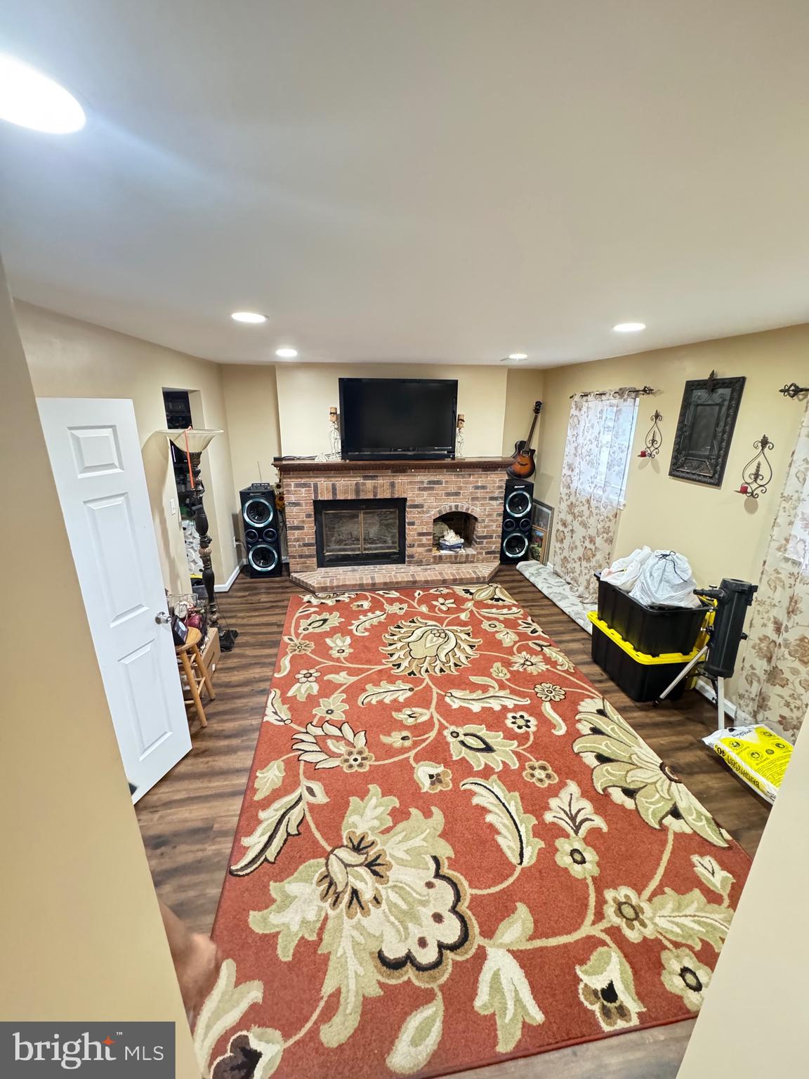 9215 Landgreen Street Manassas, VA 20110 - Photo 6 of 18 a living room with furniture and a flat screen tv