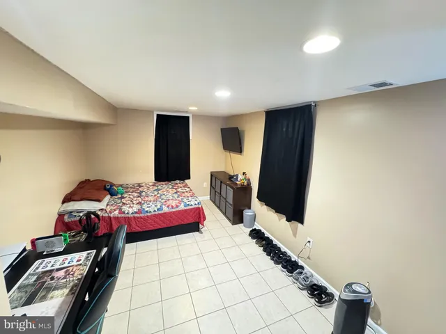 a bedroom with bed and window