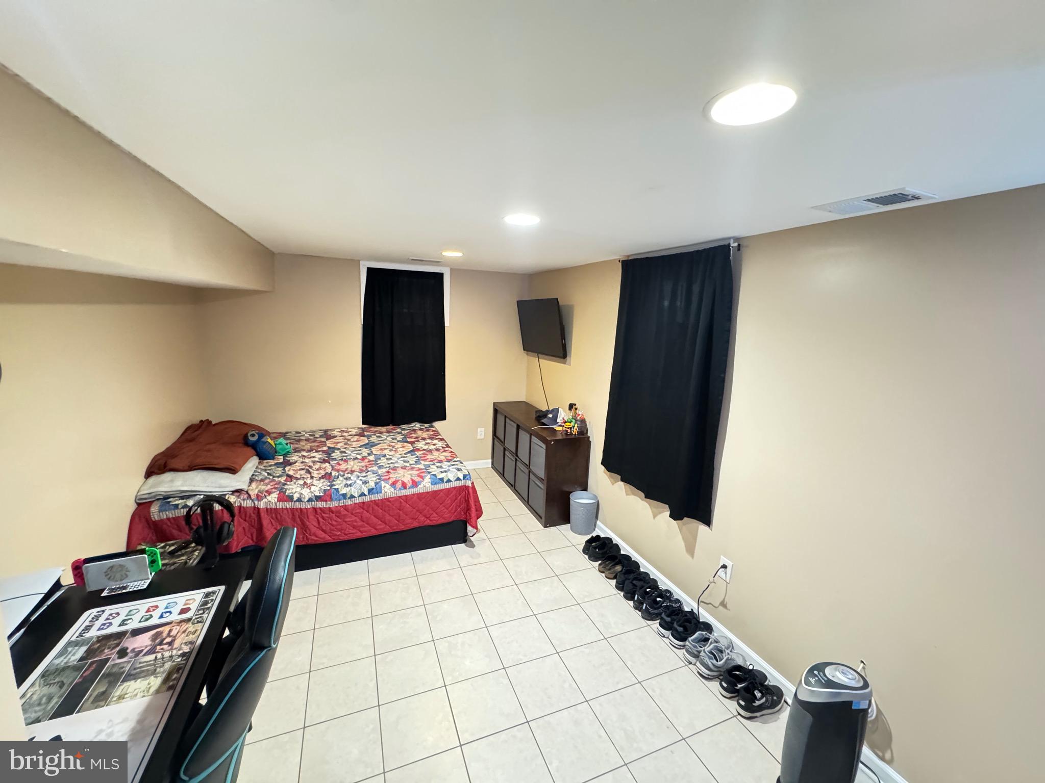 9215 Landgreen Street Manassas, VA 20110 - Photo 9 of 18 a bedroom with bed and window