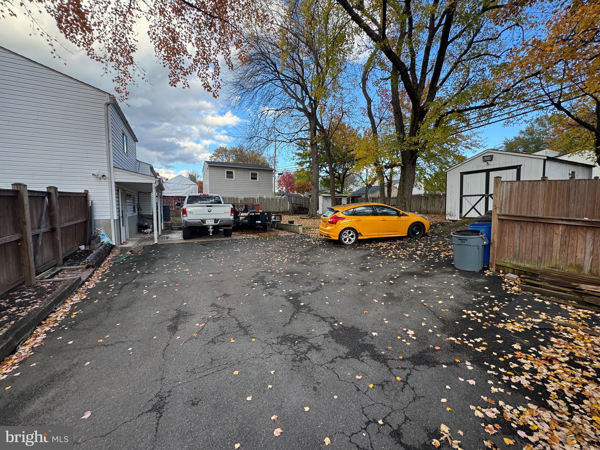 9215 Landgreen Street Manassas, VA 20110 - Photo 10 of 18 a backyard of a house with barbeque oven a table and chairs