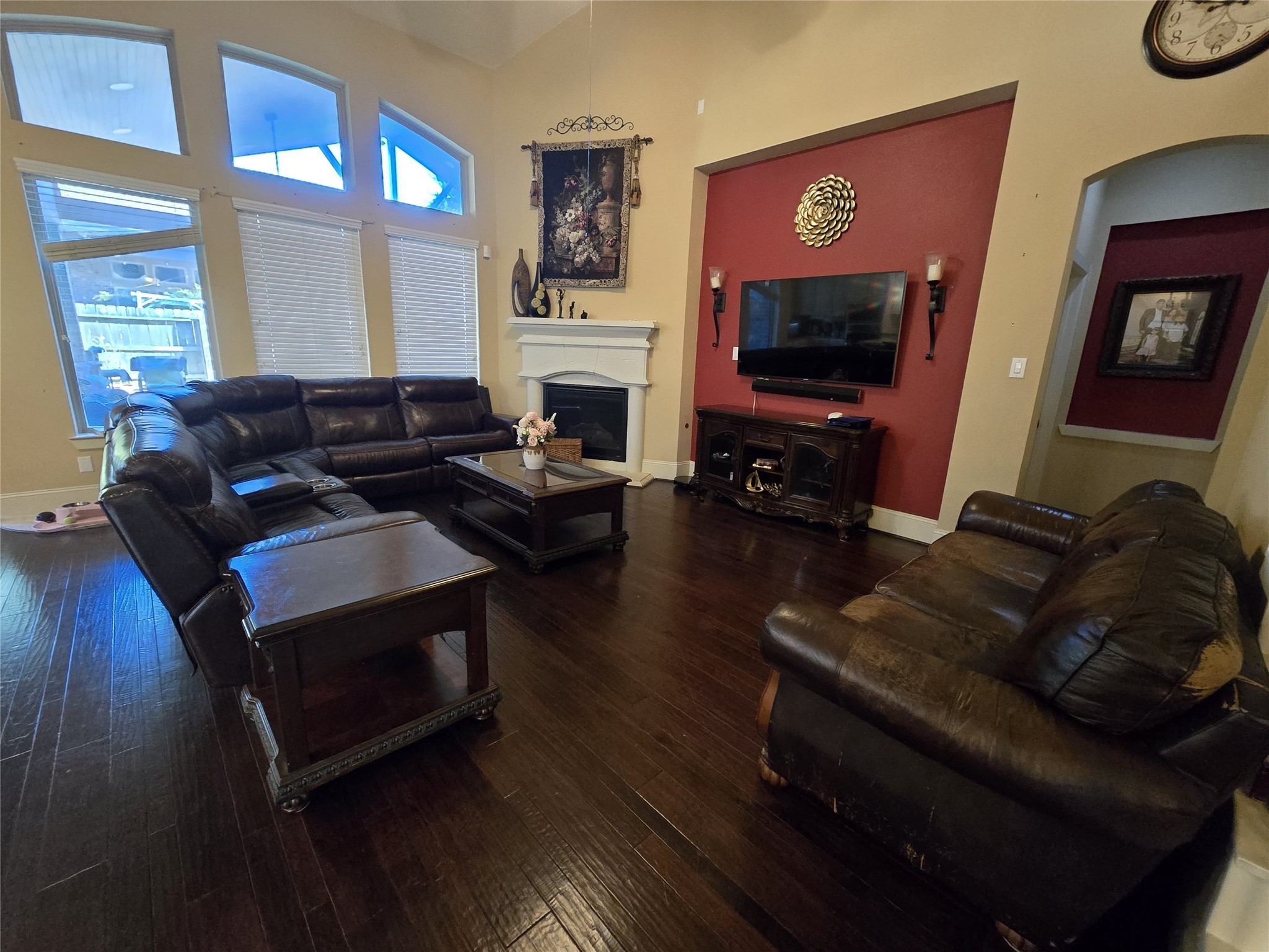 4815 Ashley Hope Drive Katy, TX 77494 - Photo 15 of 26 a living room with furniture a flat screen tv and a fireplace