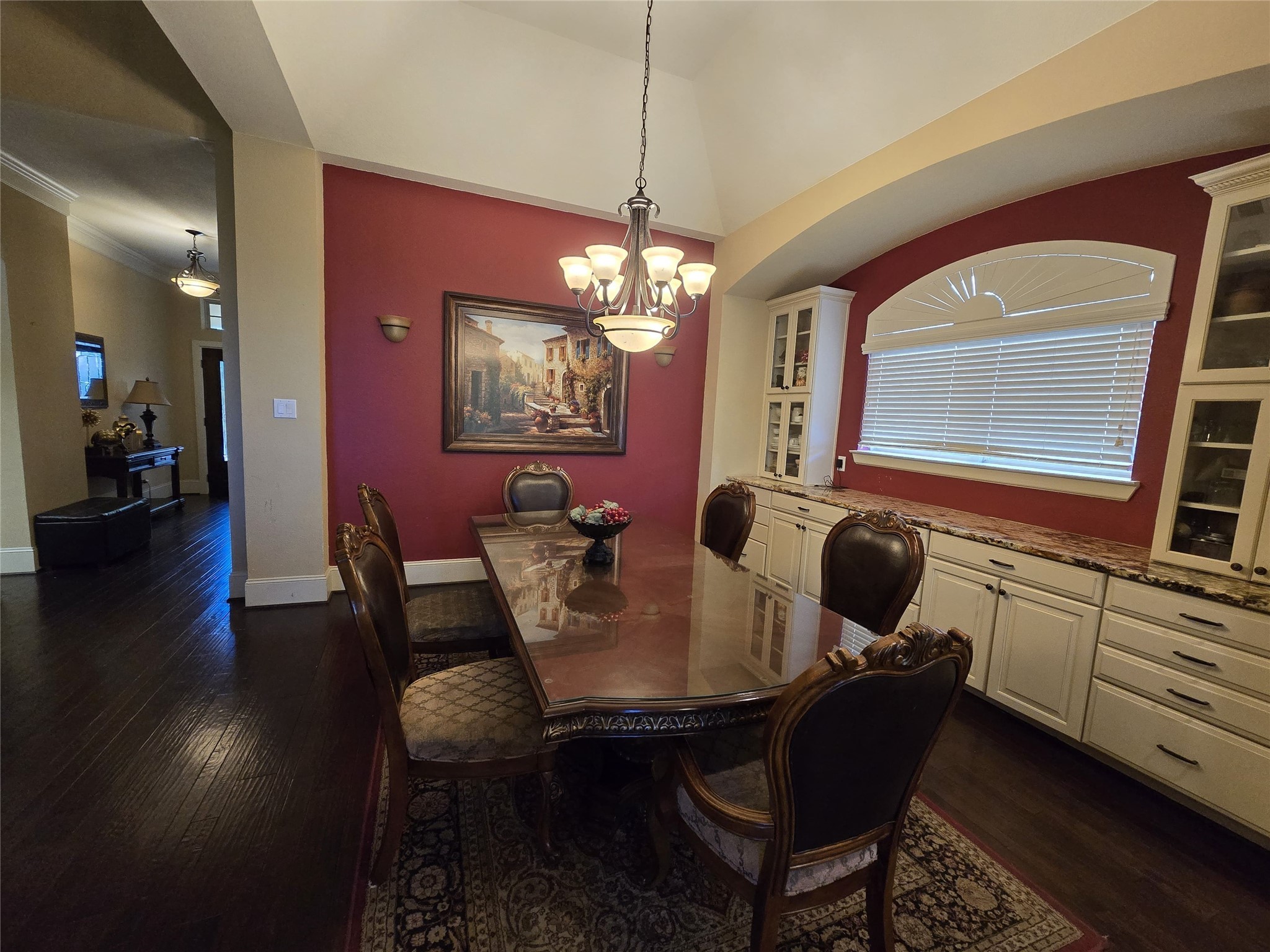 4815 Ashley Hope Drive Katy, TX 77494 - Photo 16 of 26 a dining room with furniture a chandelier and wooden floor