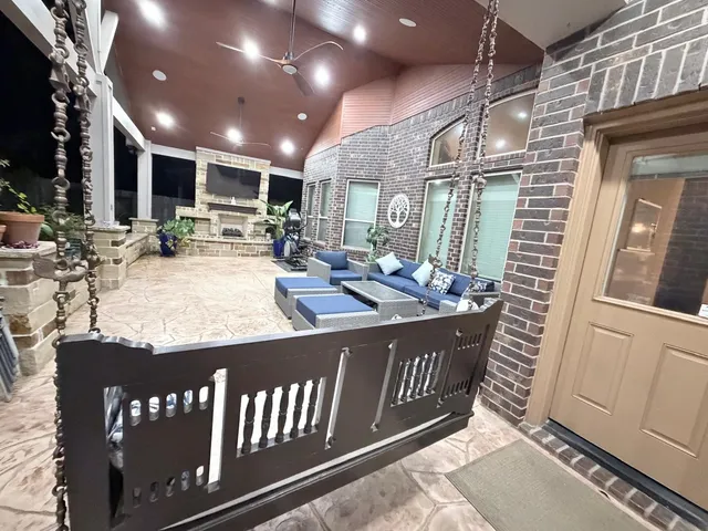 a view of a chairs and table in a patio