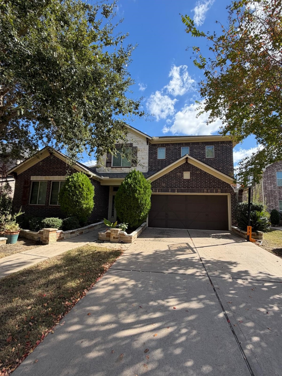 4815 Ashley Hope Drive Katy, TX 77494 - Photo 25 of 26 a front view of a house with a yard and garage