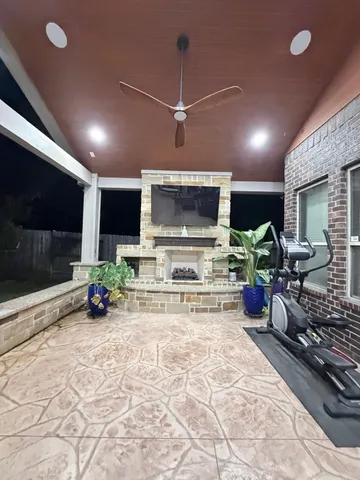 a view of a patio with couches table and chairs with potted plants
