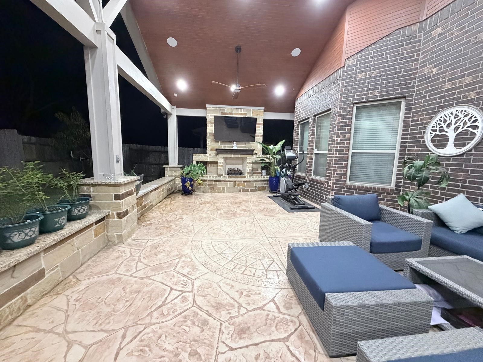 4815 Ashley Hope Drive Katy, TX 77494 - Photo 6 of 26 a view of a patio with couches table and chairs with potted plants