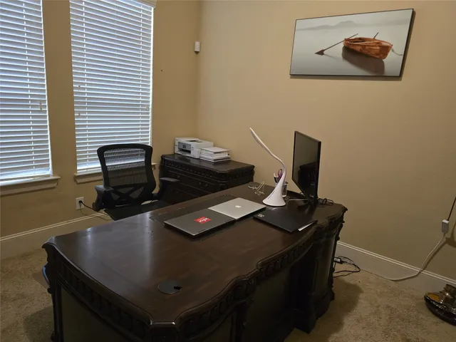 a laptop computer sitting on top of a desk