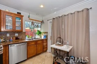 a kitchen that has a sink and a stove in it