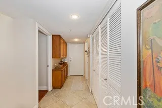 a view of a hallway with a livingroom and a dinning room